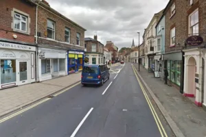 Firefighters respond to smoke billowing out of a shop in Malton