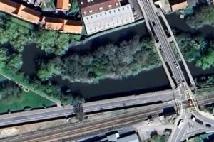 Woman stumbles down embankment and ends in river
