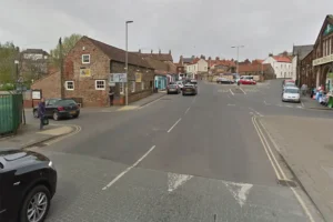 Woman in her 90s seriously hurt after being hit by skip lorry