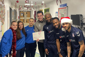 York City players spread Christmas cheer on hospital visit