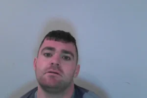 Officers search for wanted man
