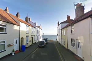 Large boulder used to damage camper van at seaside resort