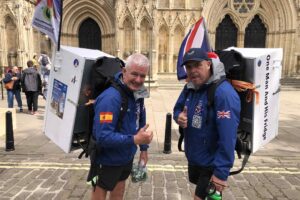 Two men with fridges strapped to their backs are in York. Here’s why