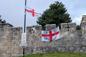 Man arrested after flag with threatening message placed on York city walls
