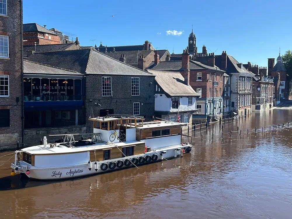 York floods in pix: Soggy on one side of the river, dry on the other