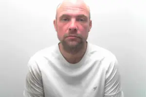 Drunken burglar who waved at CCTV camera jailed