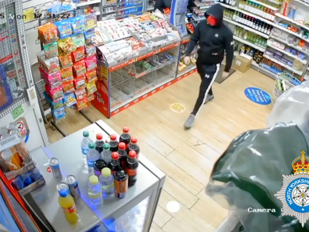 Watch: Raider caught on camera threatening York shop staff in attempted robbery