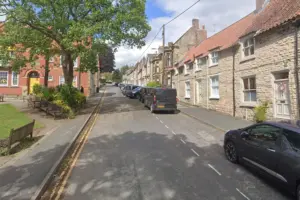 Vandals damage doors and frighten residents on Pickering street