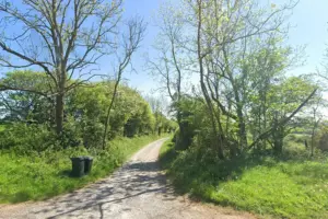 Farmer and firefighters rescue motorists stranded down track