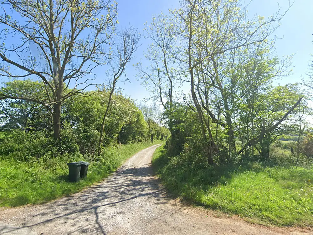 Farmer and firefighters rescue motorists stranded down track