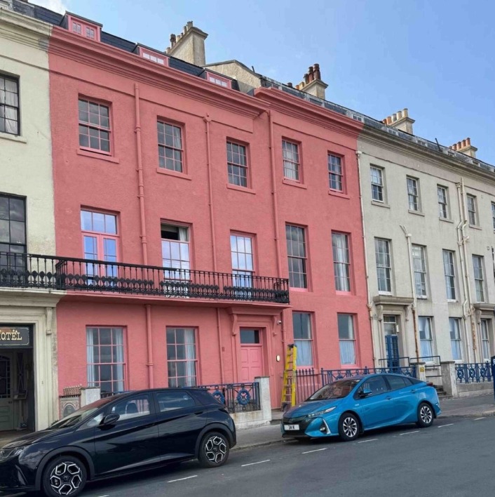 Hotel painted pink without permission after a mix-up with the paperwork