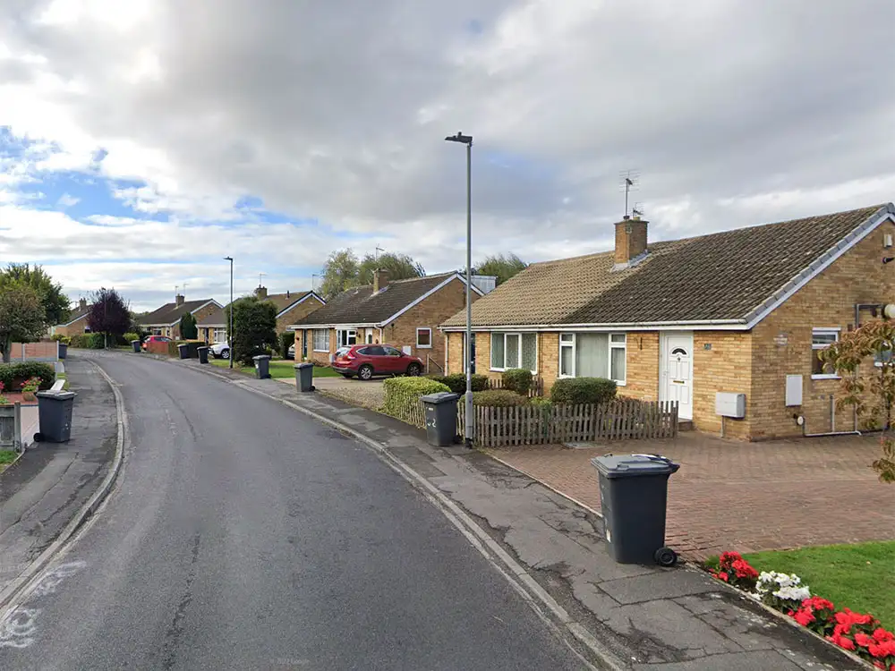 Driver loads up chairs from back garden into his van and drives off