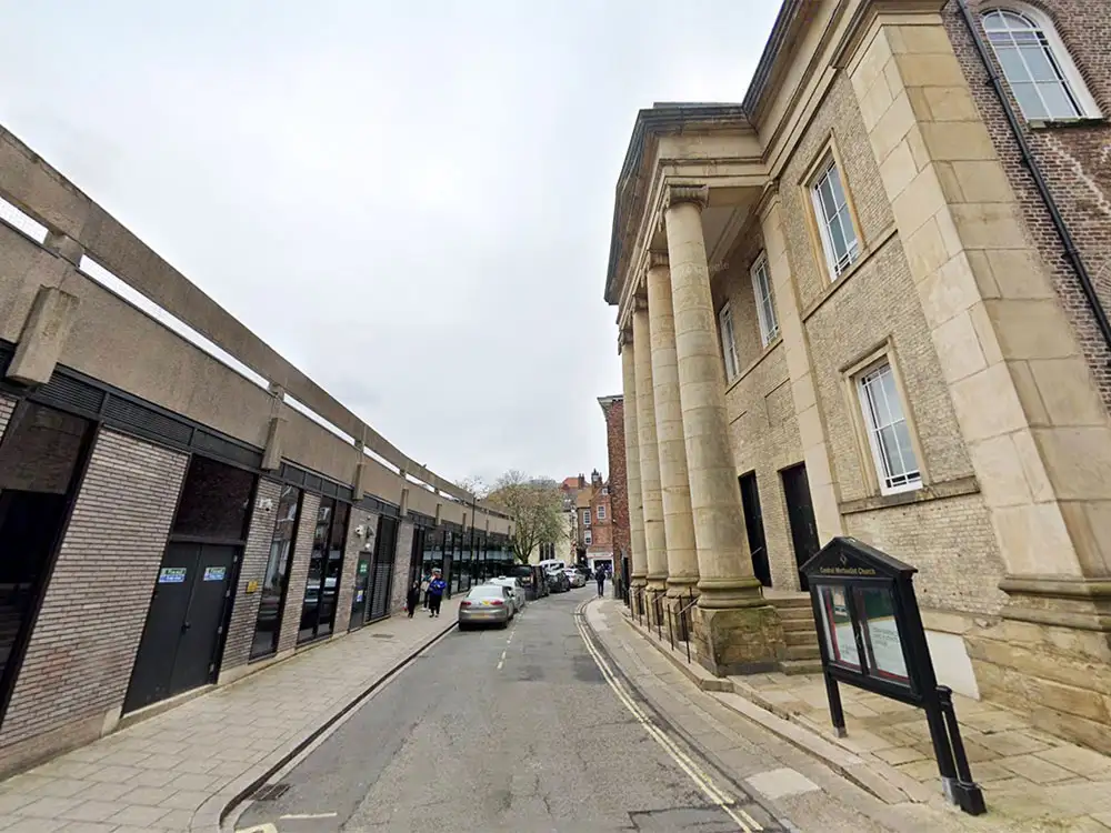 Man arrested for strangulation after woman attacked outside York church