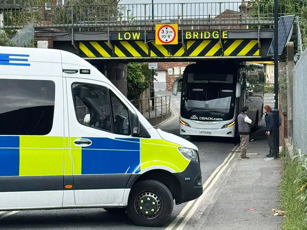 Rail services paused after coach gets stuck under York bridge