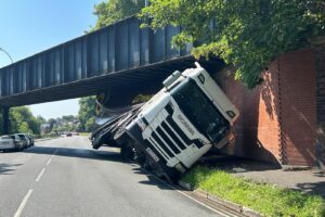 Lorry wedged under old rail bridge in York