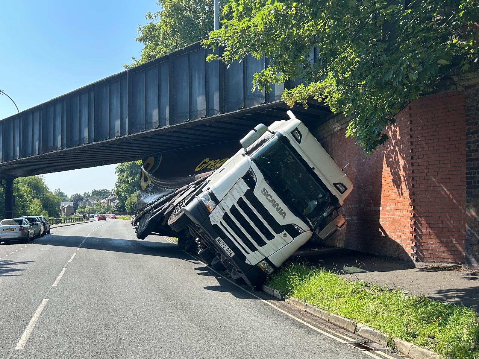 UPDATED: Lorry wedged under old rail bridge in York