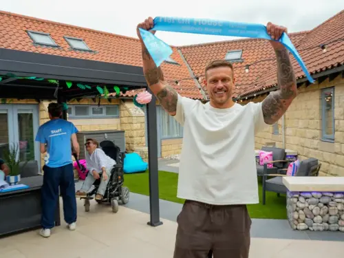 Love Island star opens new charity courtyard inspired by the hit TV show
