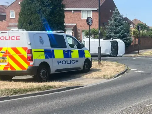 Car left on its side after crash on main York road
