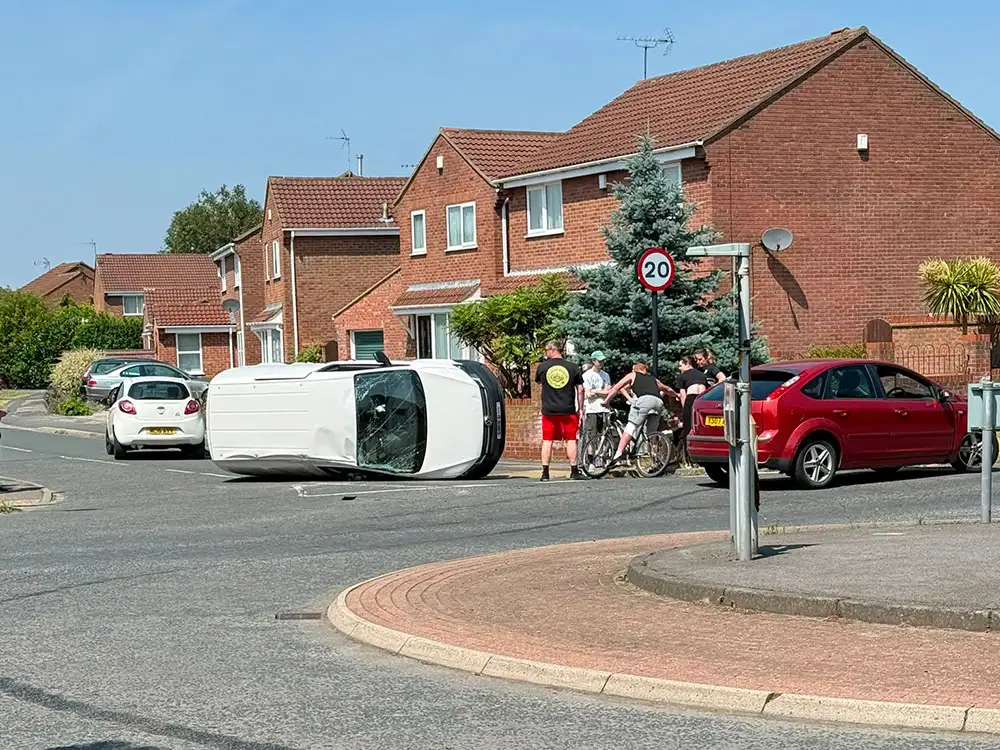 Car left on its side after crash on main York road