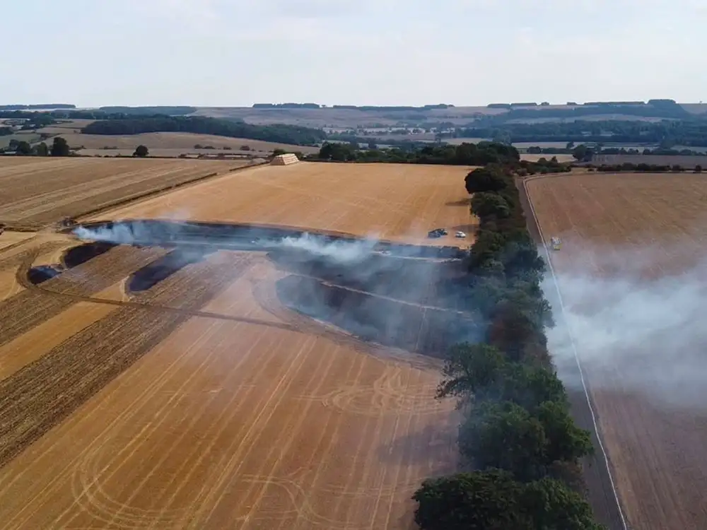 Fire crews tackle 100m-long field blaze