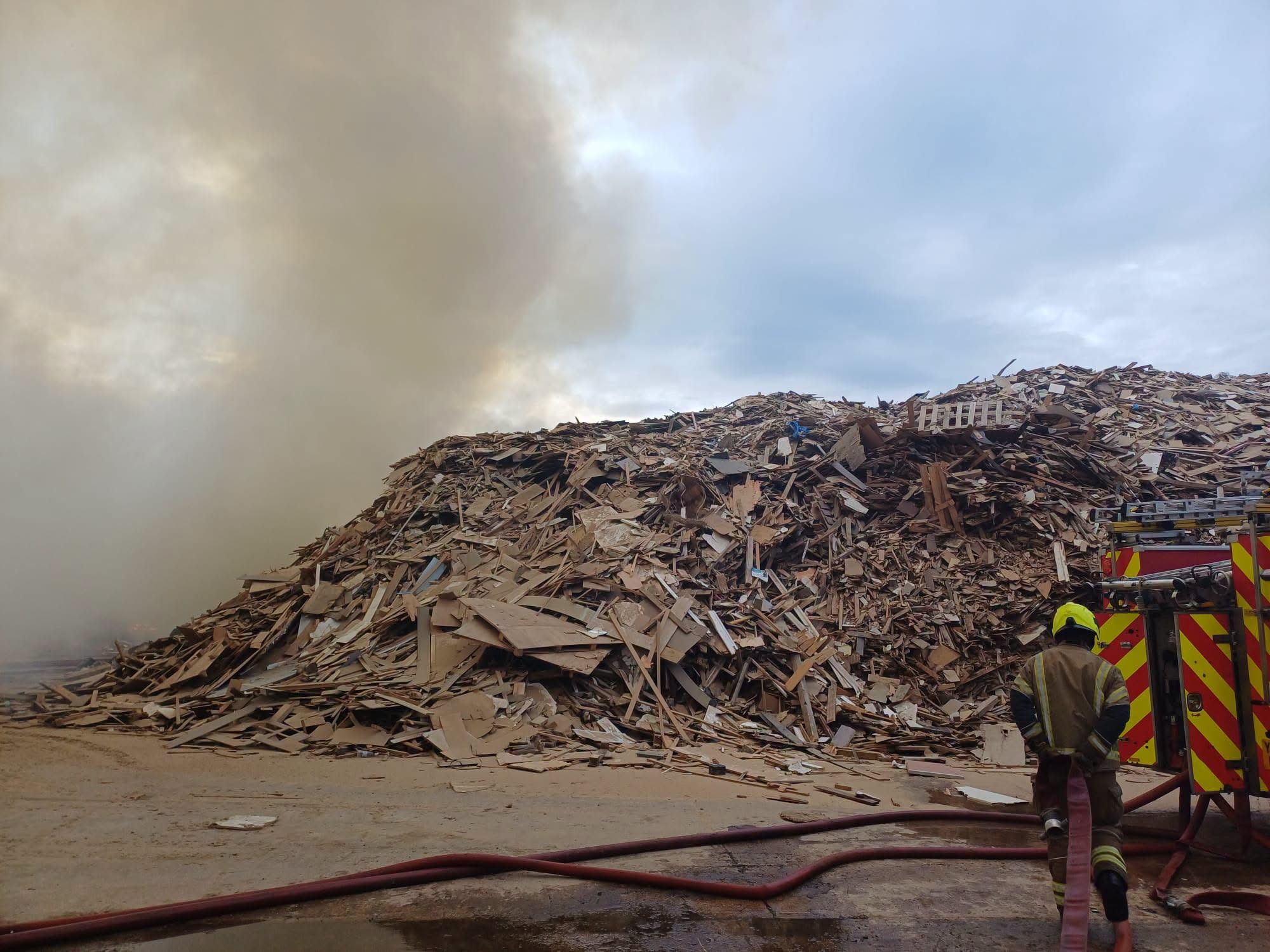 Fire crews will be at the scene of a wood pile fire near the M62 for several days